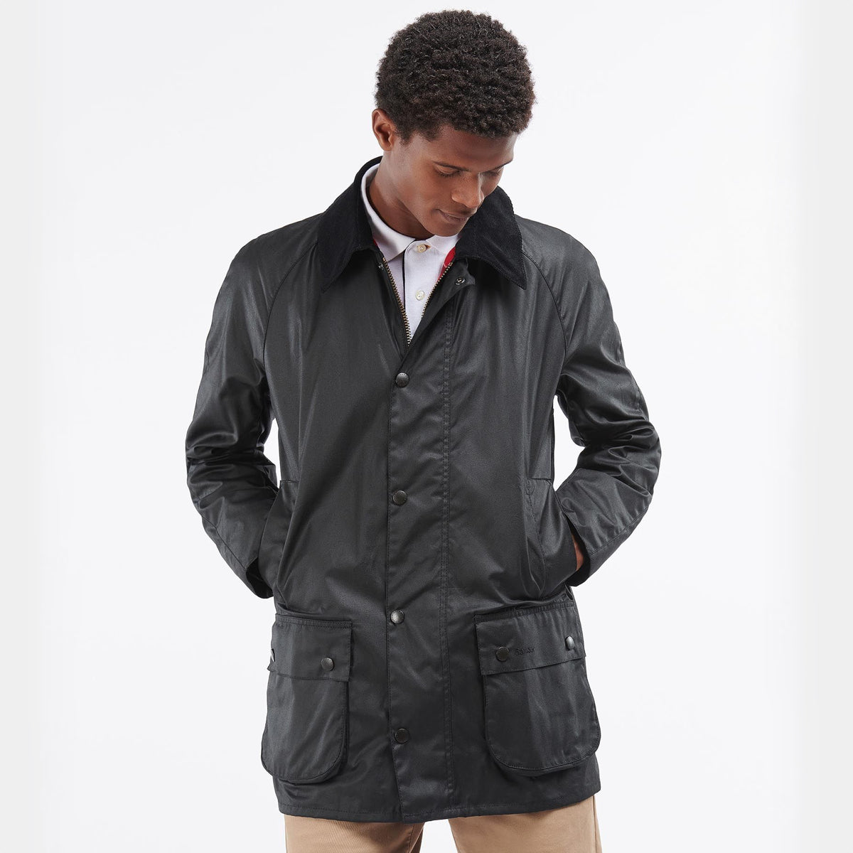 Model wearing Barbour Beausby black waxed jacket