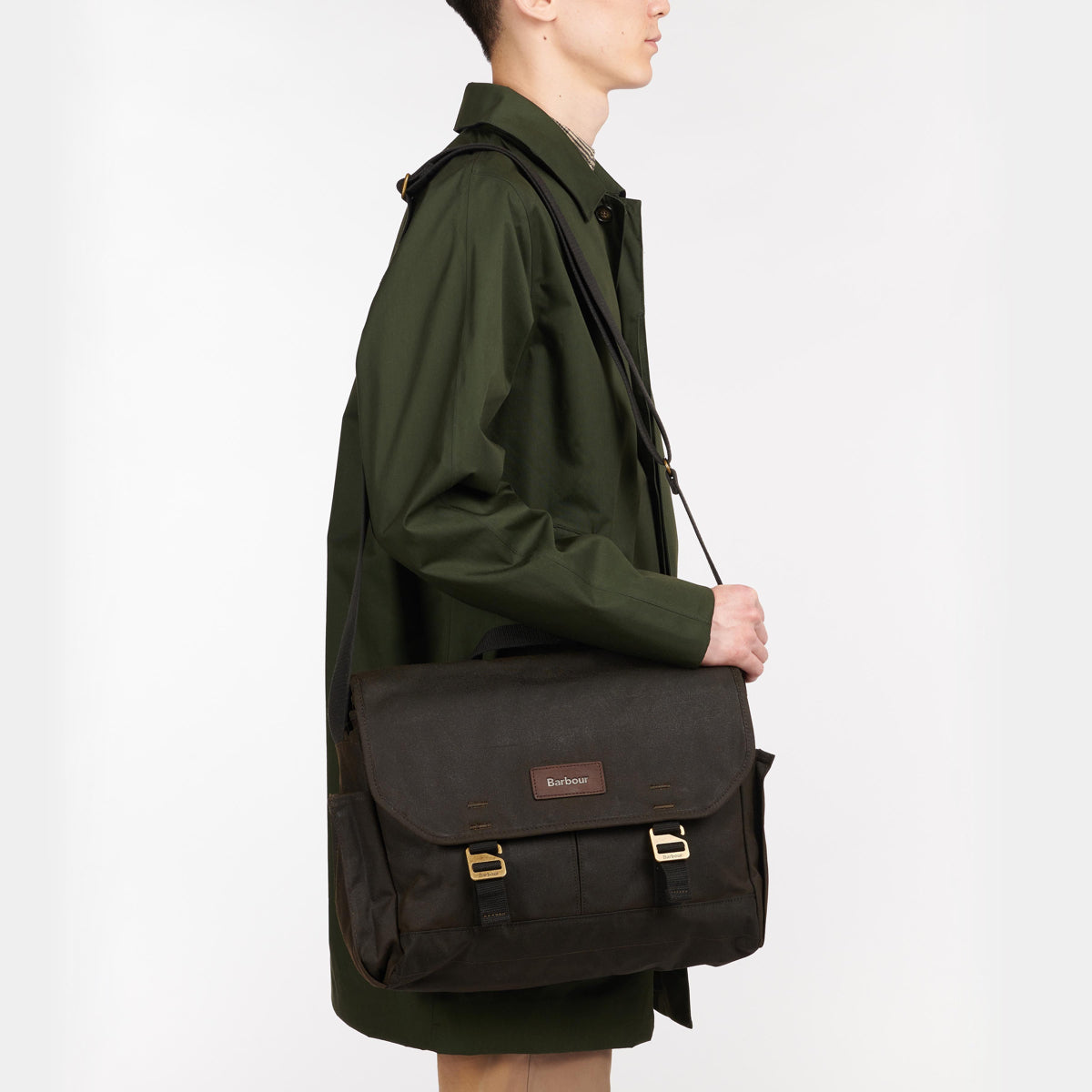 Barbour Wax Messenger Bag Olive held by model