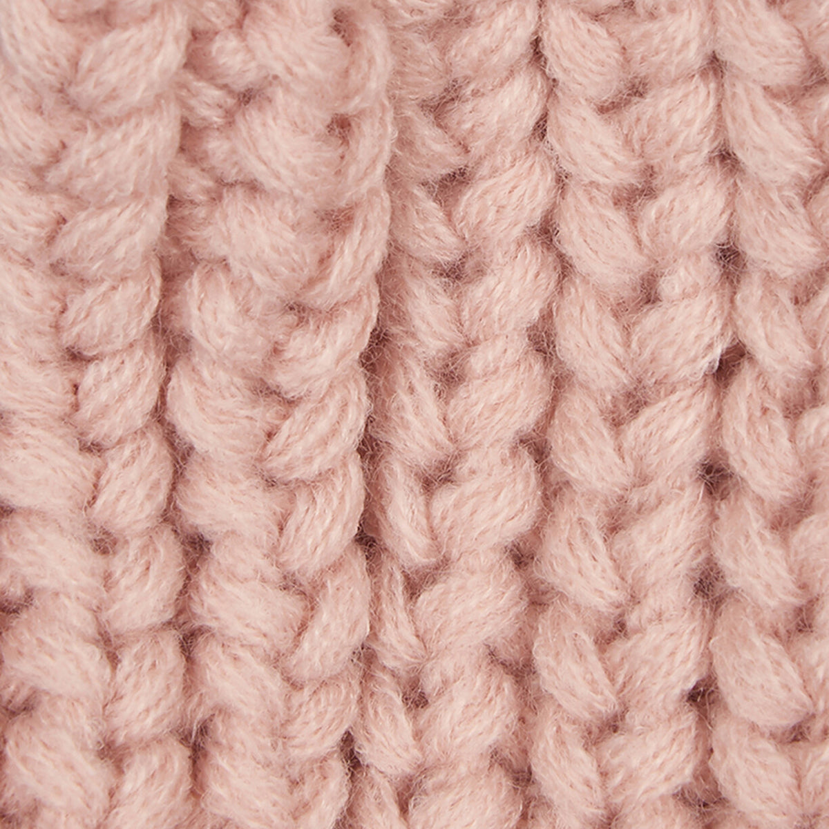 Close-up of soft pink chunky knit fabric from a Barbour Saltburn Beanie