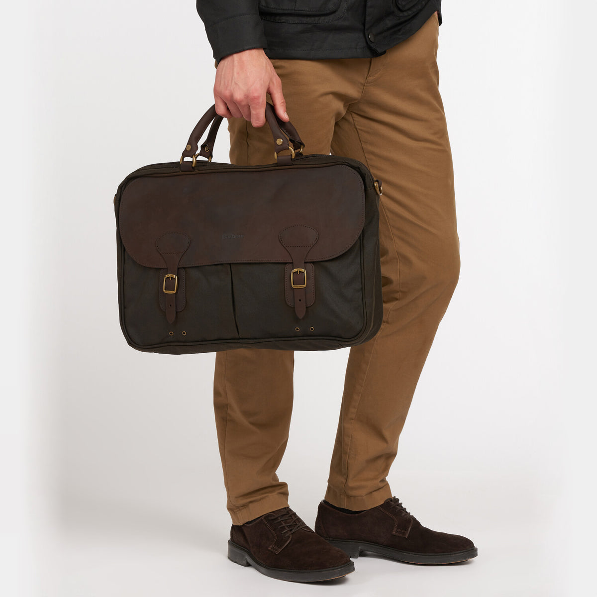 Barbour Wax Leather Briefcase in Olive styled for commuting – placed on wooden desk with accessories
