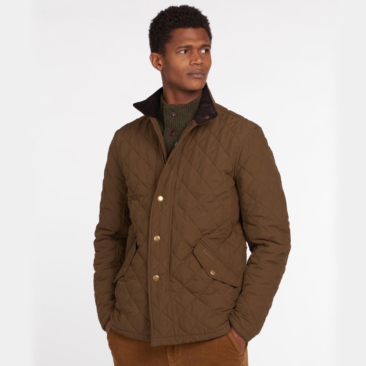 Model wearing Barbour Shoveler Jacket in Dark Sand