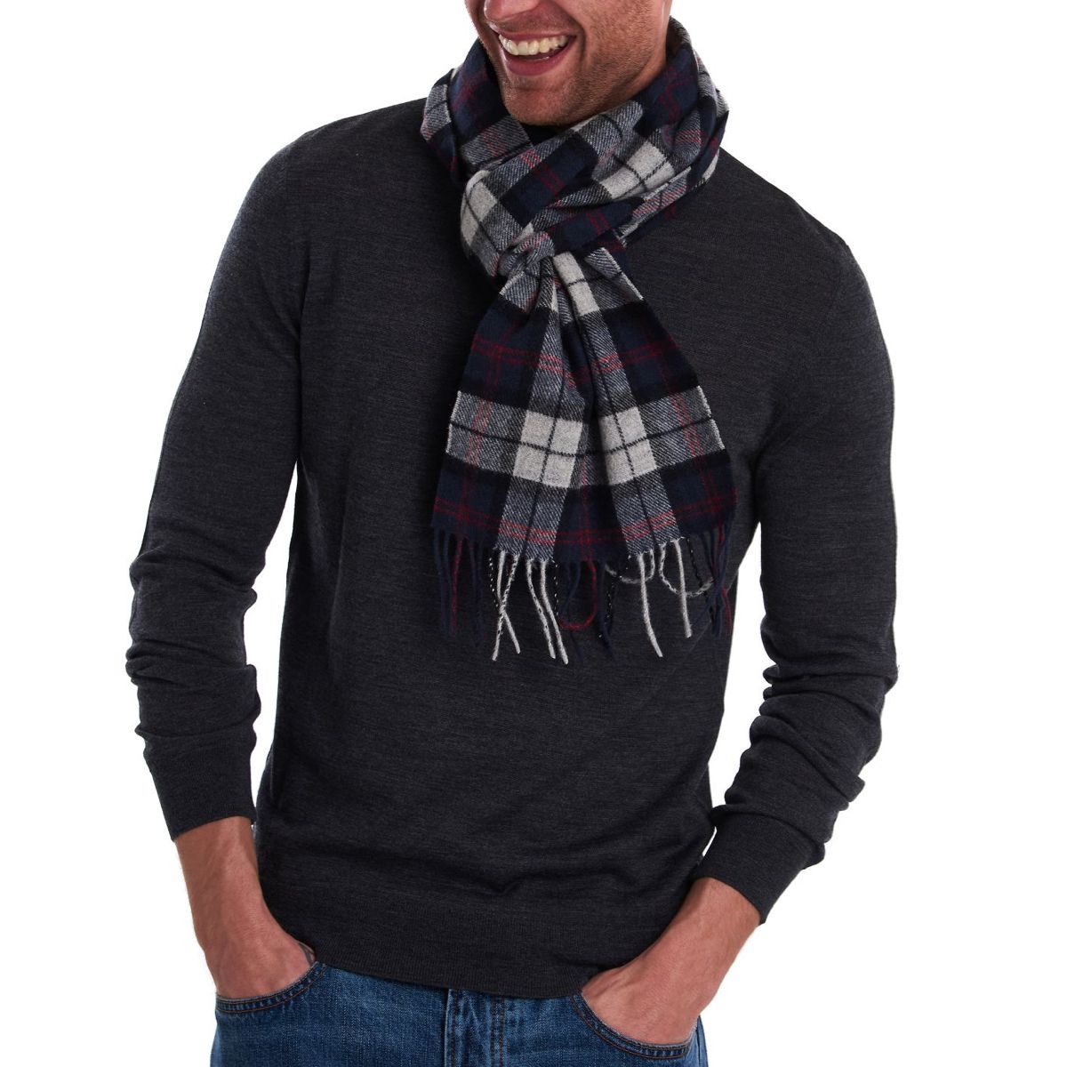 Man wearing Barbour tartan lambswool scarf in blue and grey around his neck.