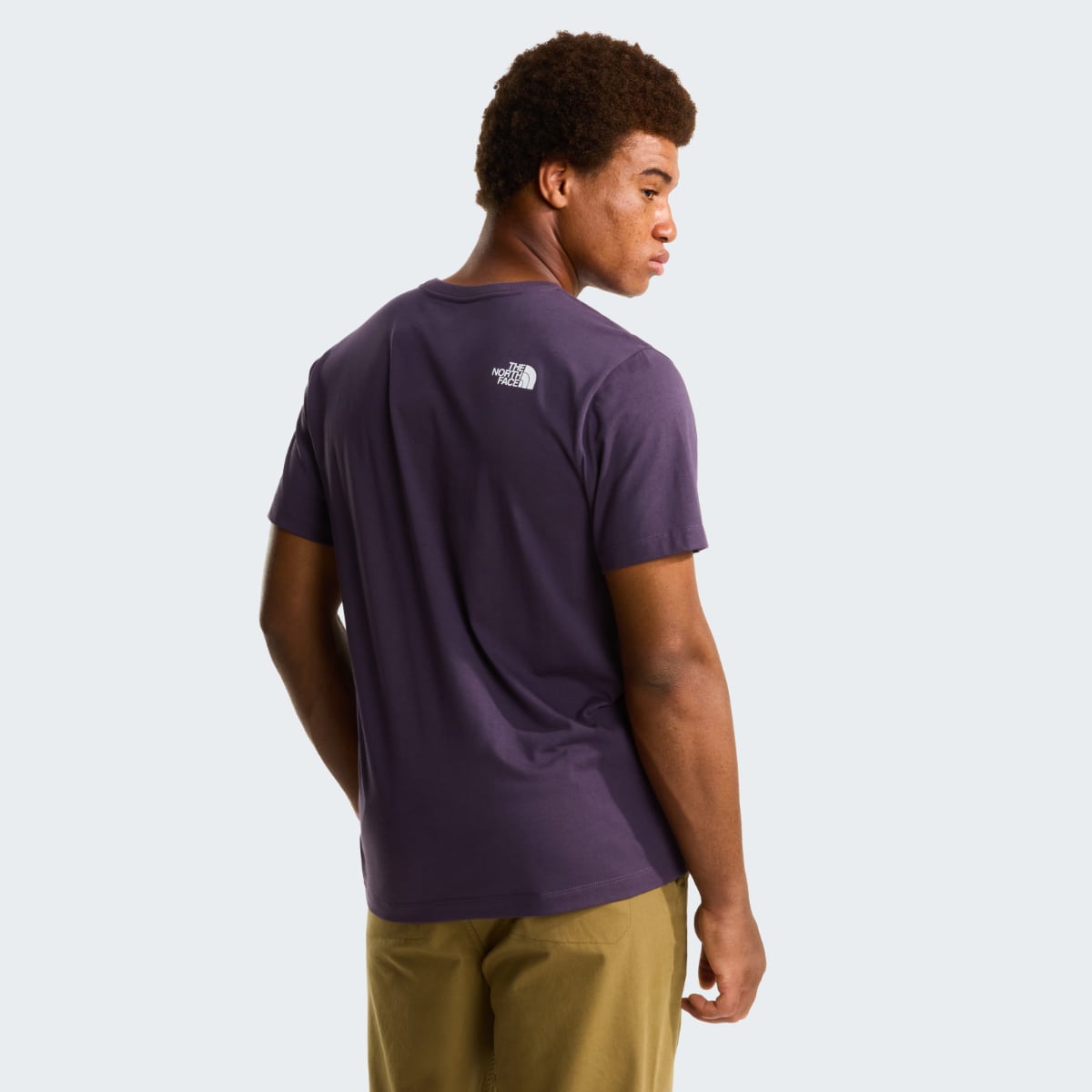 Back view of a purple The North Face Evolution Half Dome short sleeve T shirt with a small white logo on the upper back.