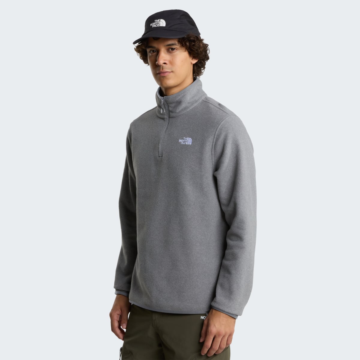 Front view of a male model wearing The North Face Glacier 1/4 Zip Fleece in mid grey heather.