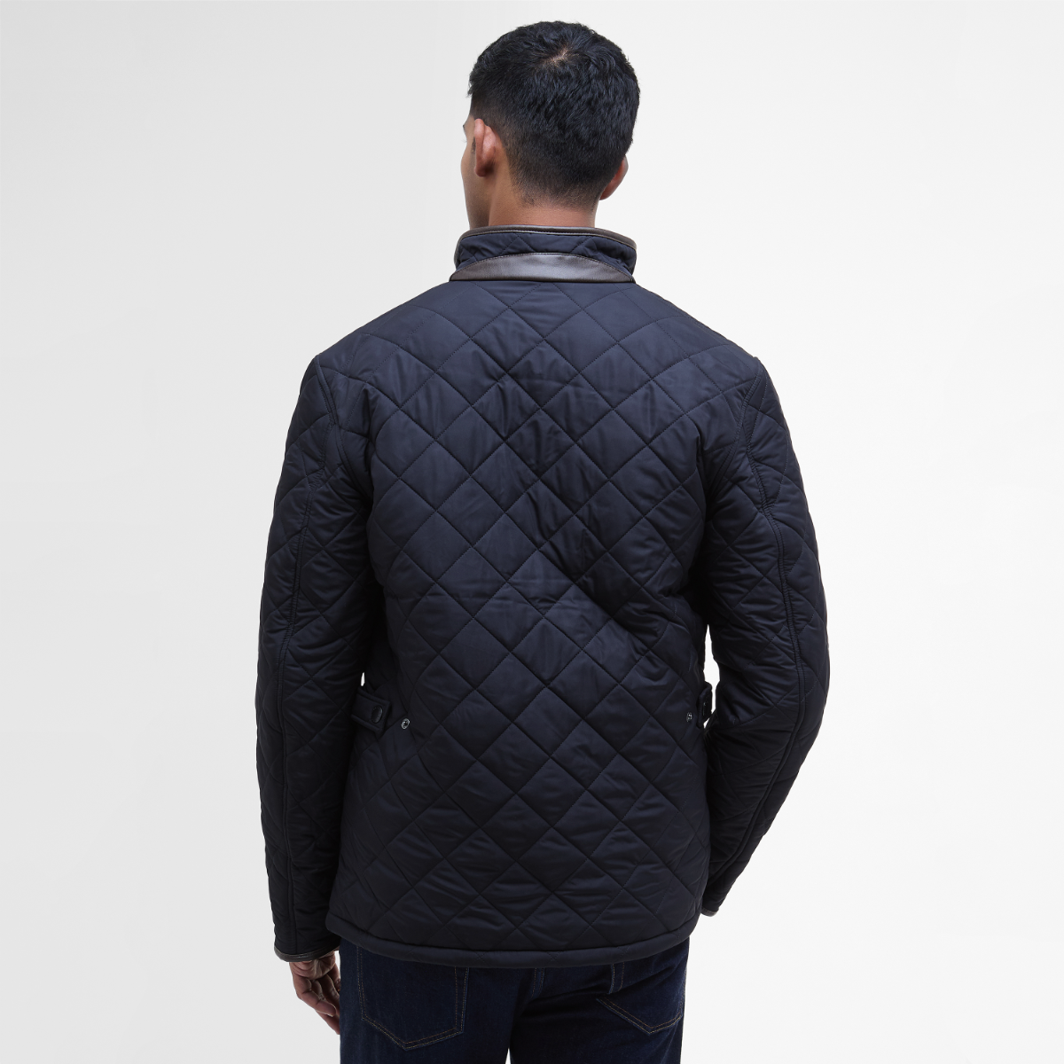 Rear view of Barbour Powell Quilted Jacket in navy on model