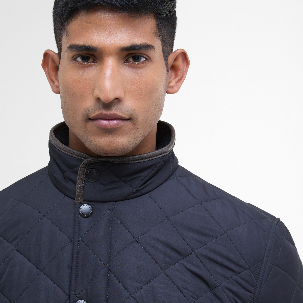 Detail of collar and trim on navy jacket