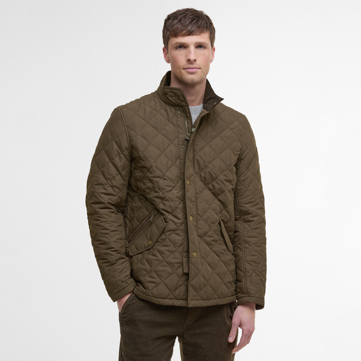 Model wearing Barbour Shoveler Jacket  in Dark Olive