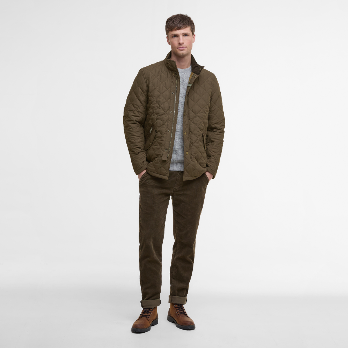Model wearing Barbour Shoveler Jacket  in Dark Olive - full height