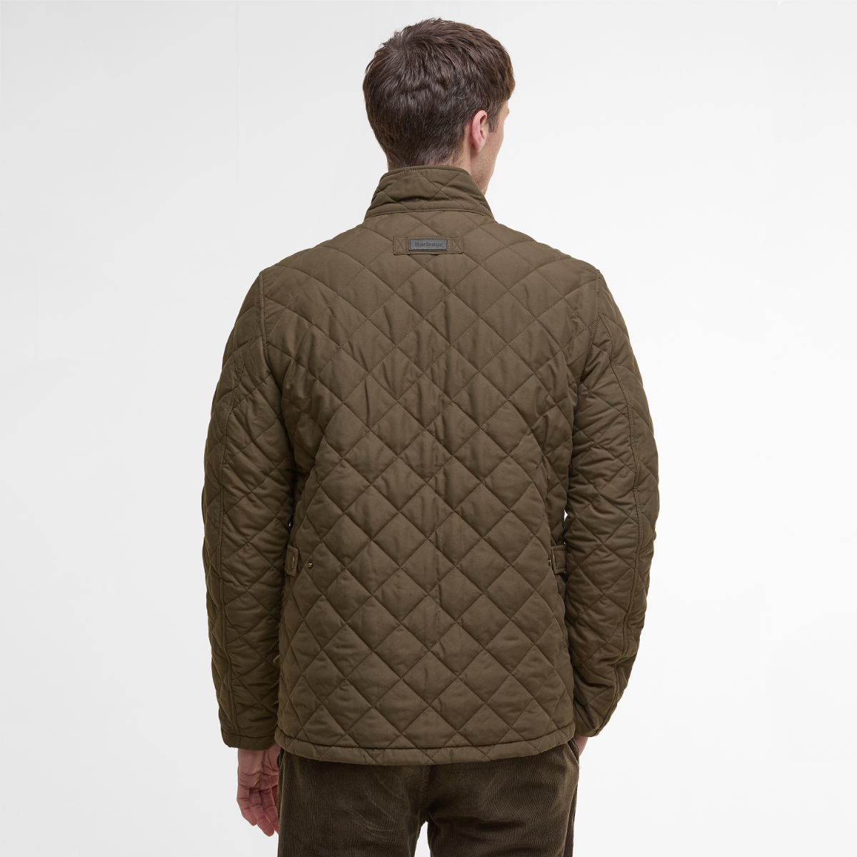Model wearing Barbour Shoveler Jacket  in Dark Olive - rear view