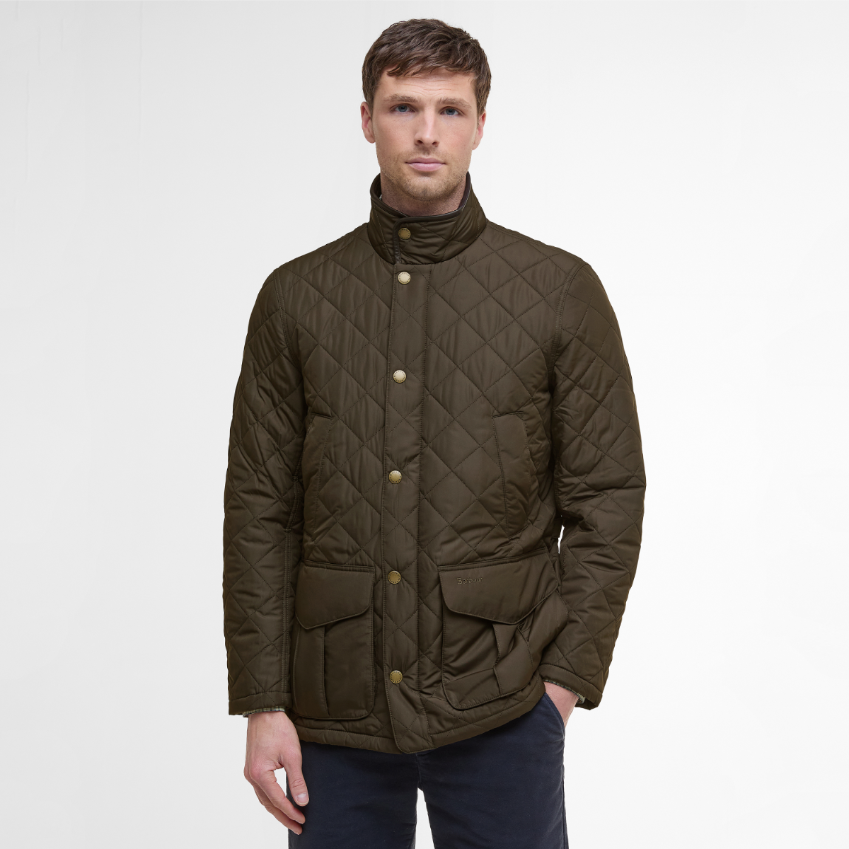 Front view of olive green Barbour Devon men’s quilted jacket on model 