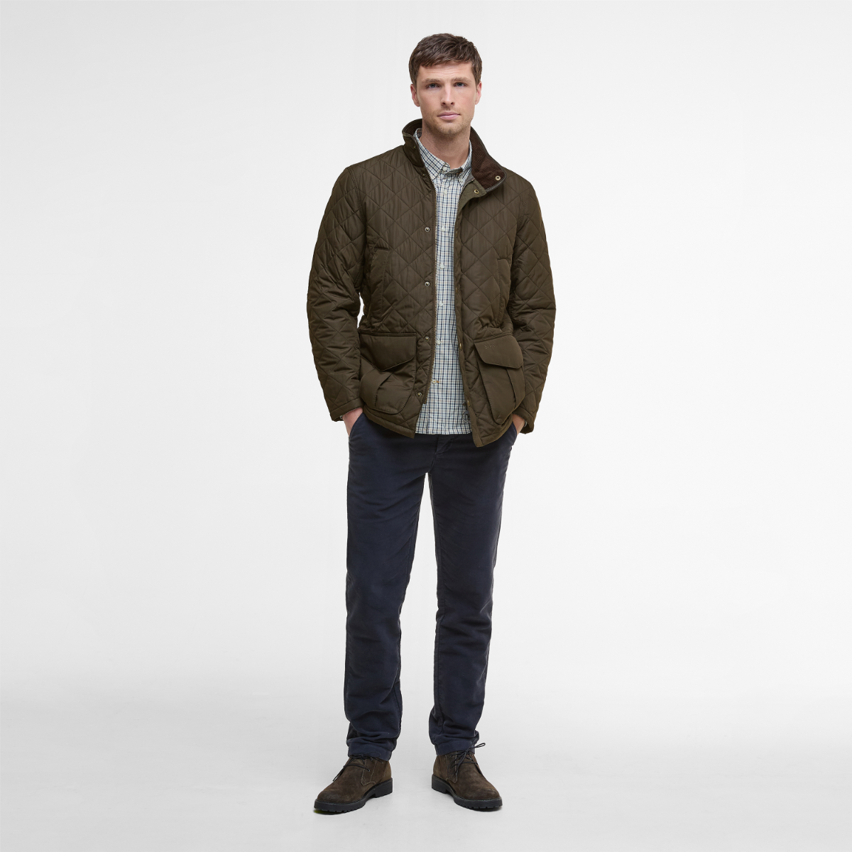 Front view of olive green Barbour Devon men’s quilted jacket on model full height