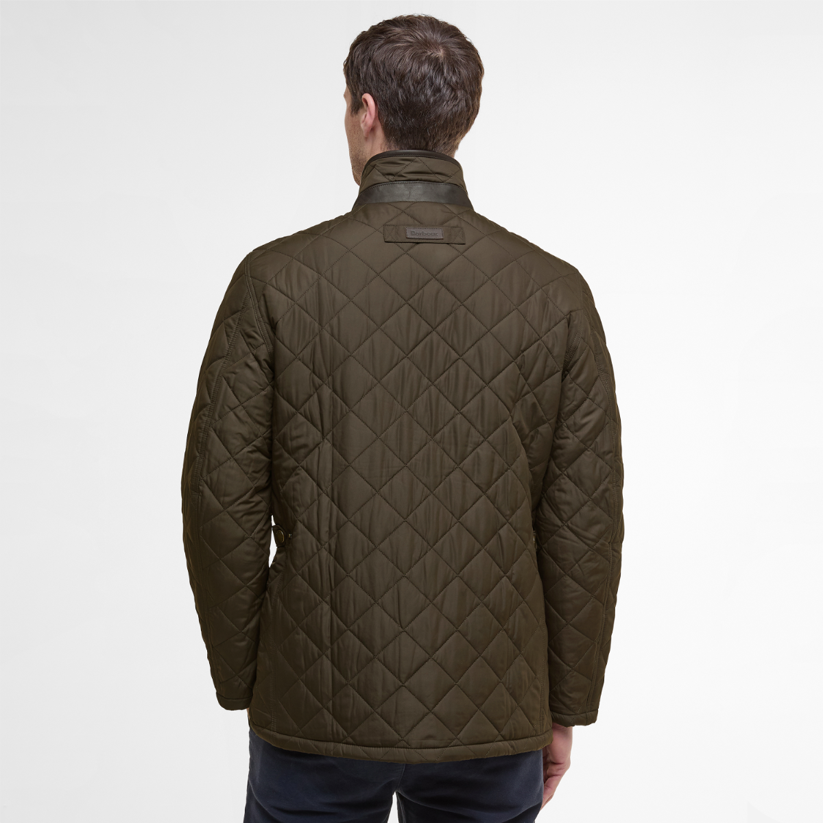 Rear view of olive green Barbour Devon men’s quilted jacket on model