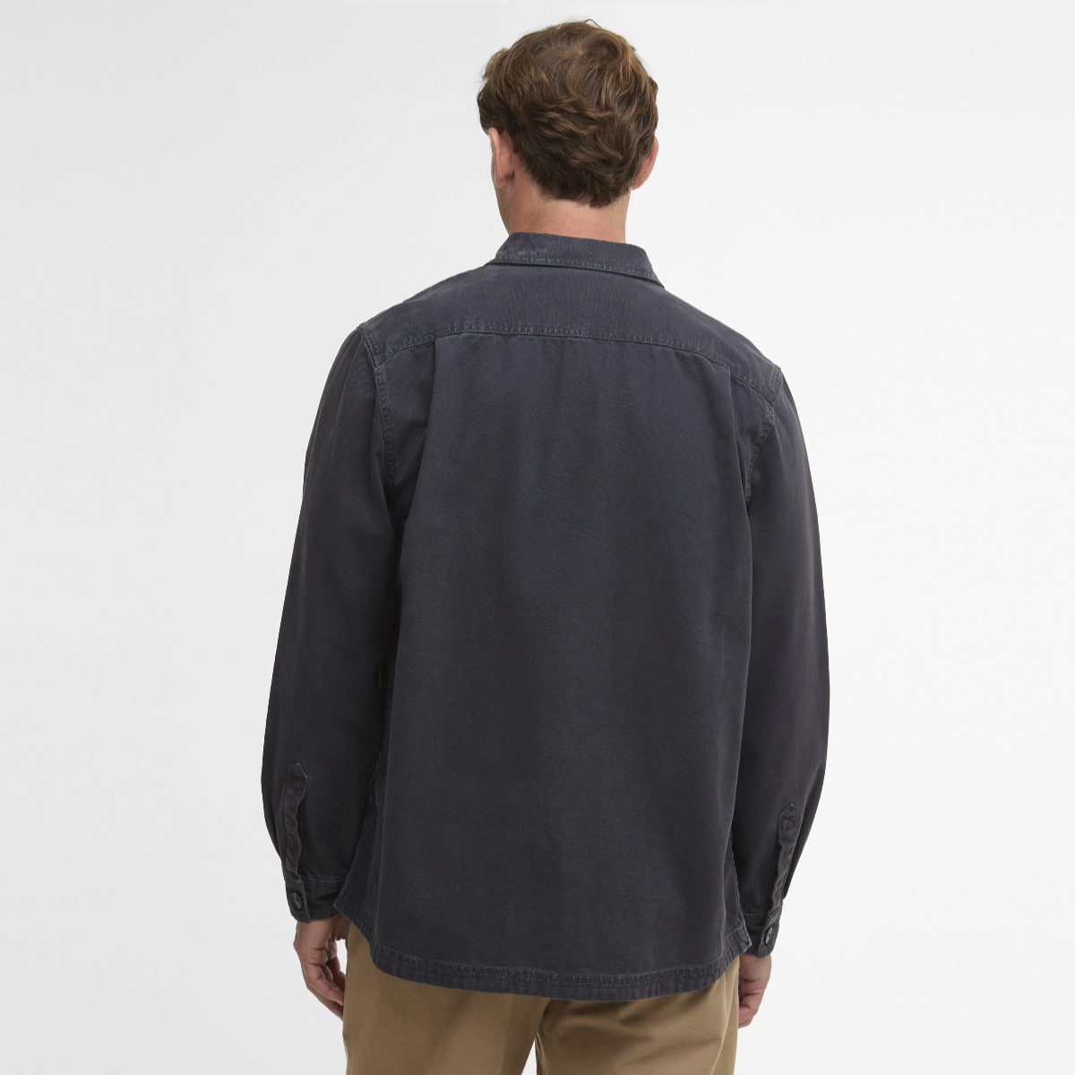 Back view of male model in navy Barbour Lingfield Canvas overshirt