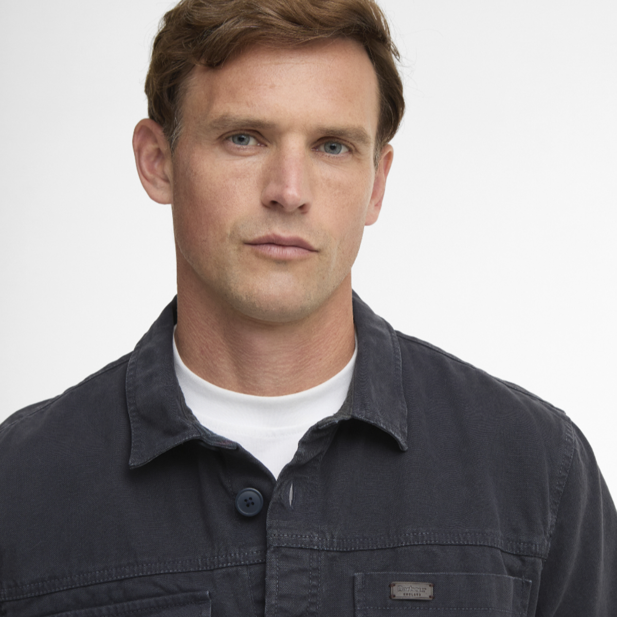 Male model wearing navy Barbour Lingfield Canvas overshirt