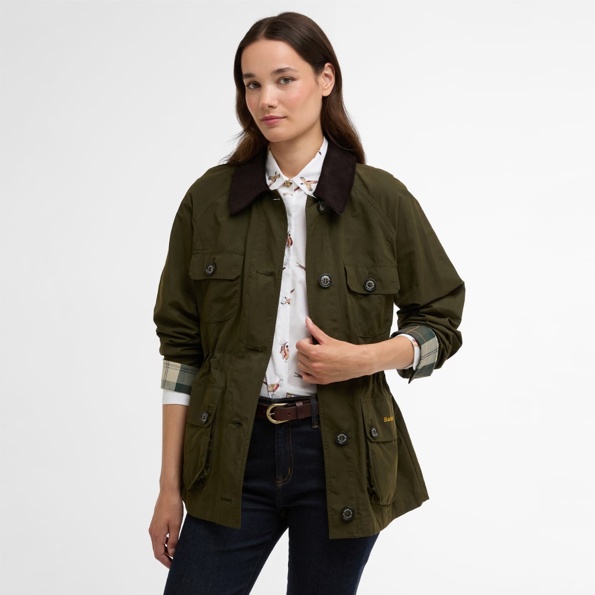 Model wearing olive Barbour Croton Casual jacket with dark corduroy collar, rolled plaid cuffs and front pockets.