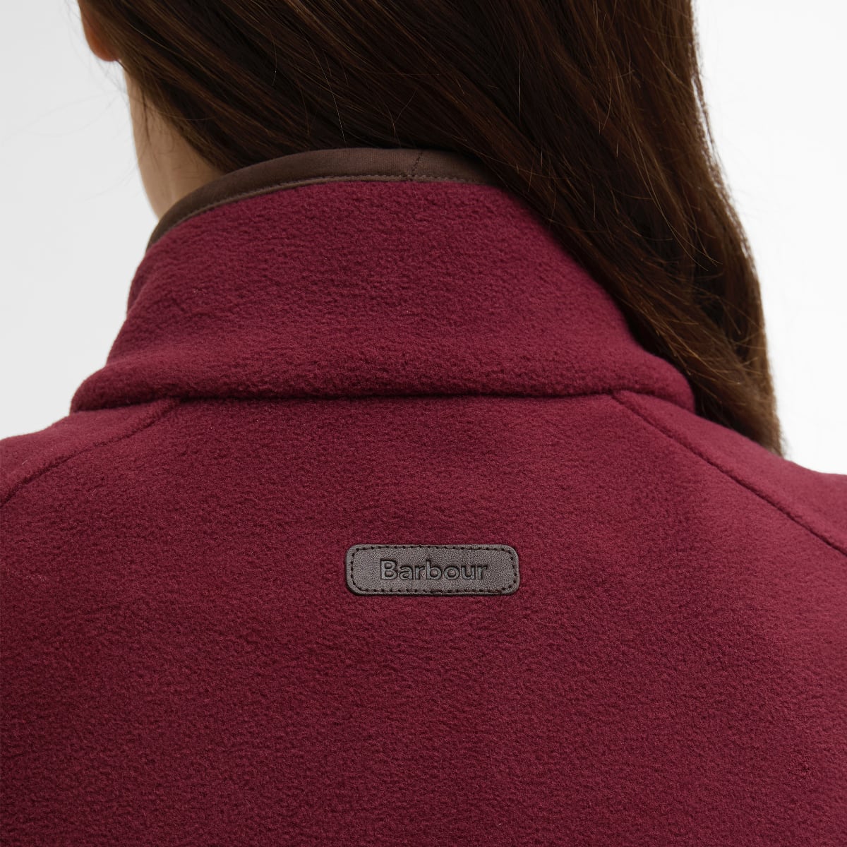 Close-up of Port Barbour Country Colton fleece gilet back showing collar detail and Barbour badge.