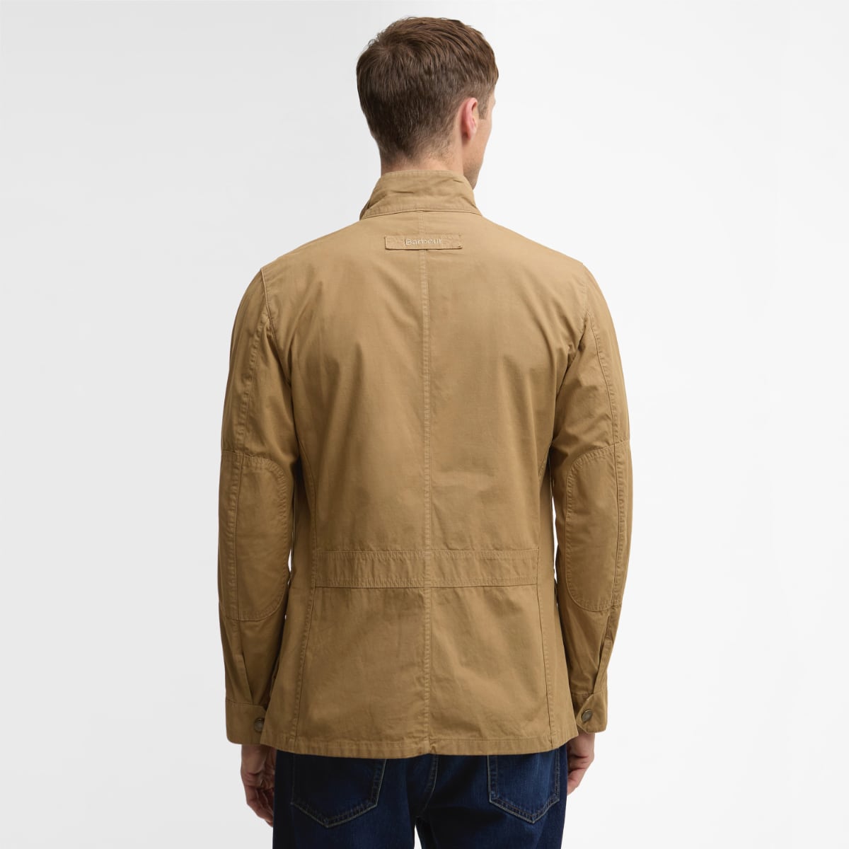 Back view of Barbour Corbridge Utility jacket in stone on a male model.