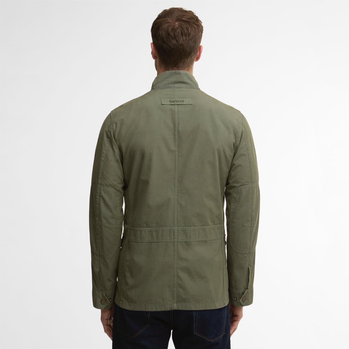 Back view of dusty olive Barbour Corbridge Utility jacket showing central seam and a label on the upper back