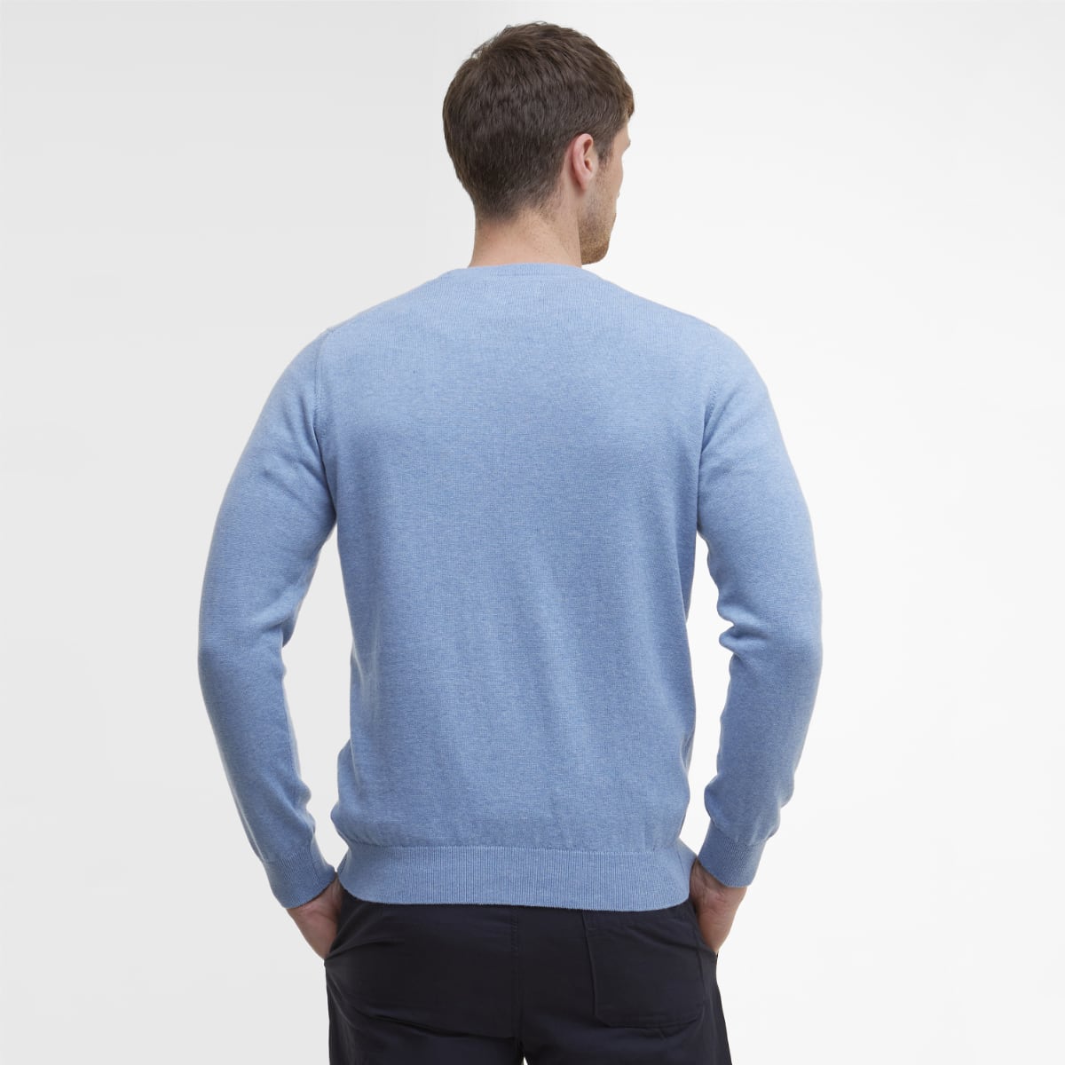Back view of Barbour Pima Cotton Crew Neck jumper in dark chambray worn by a man