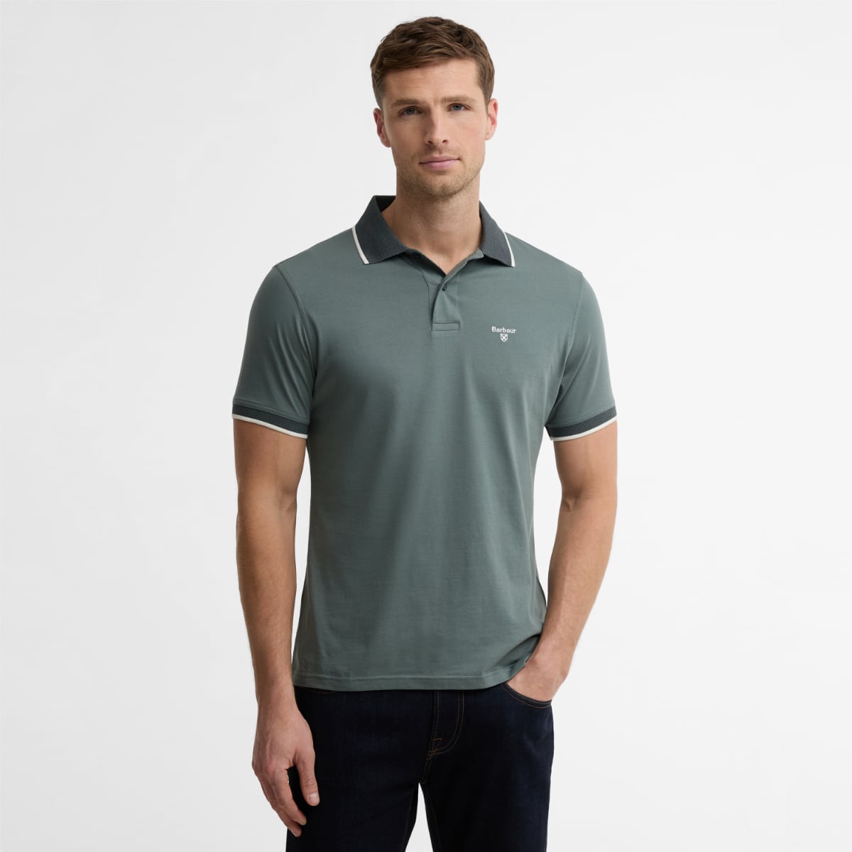 Front view of Barbour Cornsay men's polo shirt in vintage teal on a model