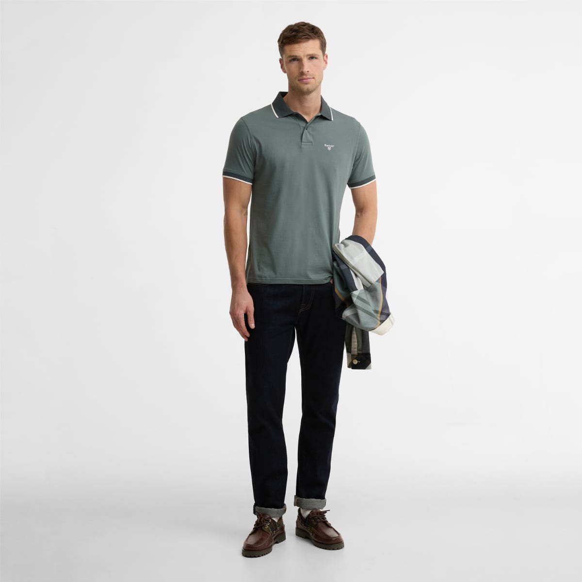 Male model wearing Barbour Cornsay polo shirt in Vintage Teal