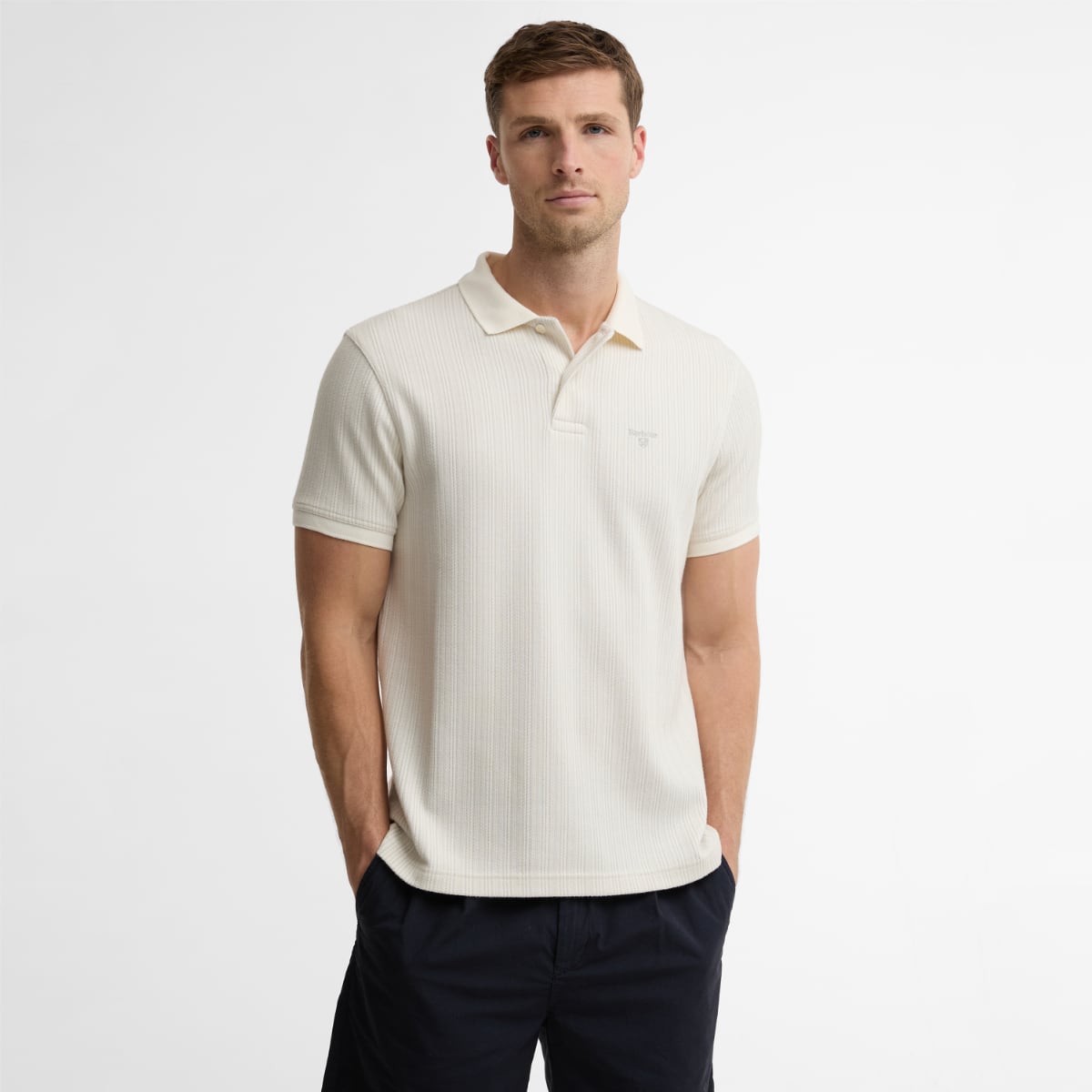 Barbour Harworth tailored men's polo shirt in whisper white worn by a male model.