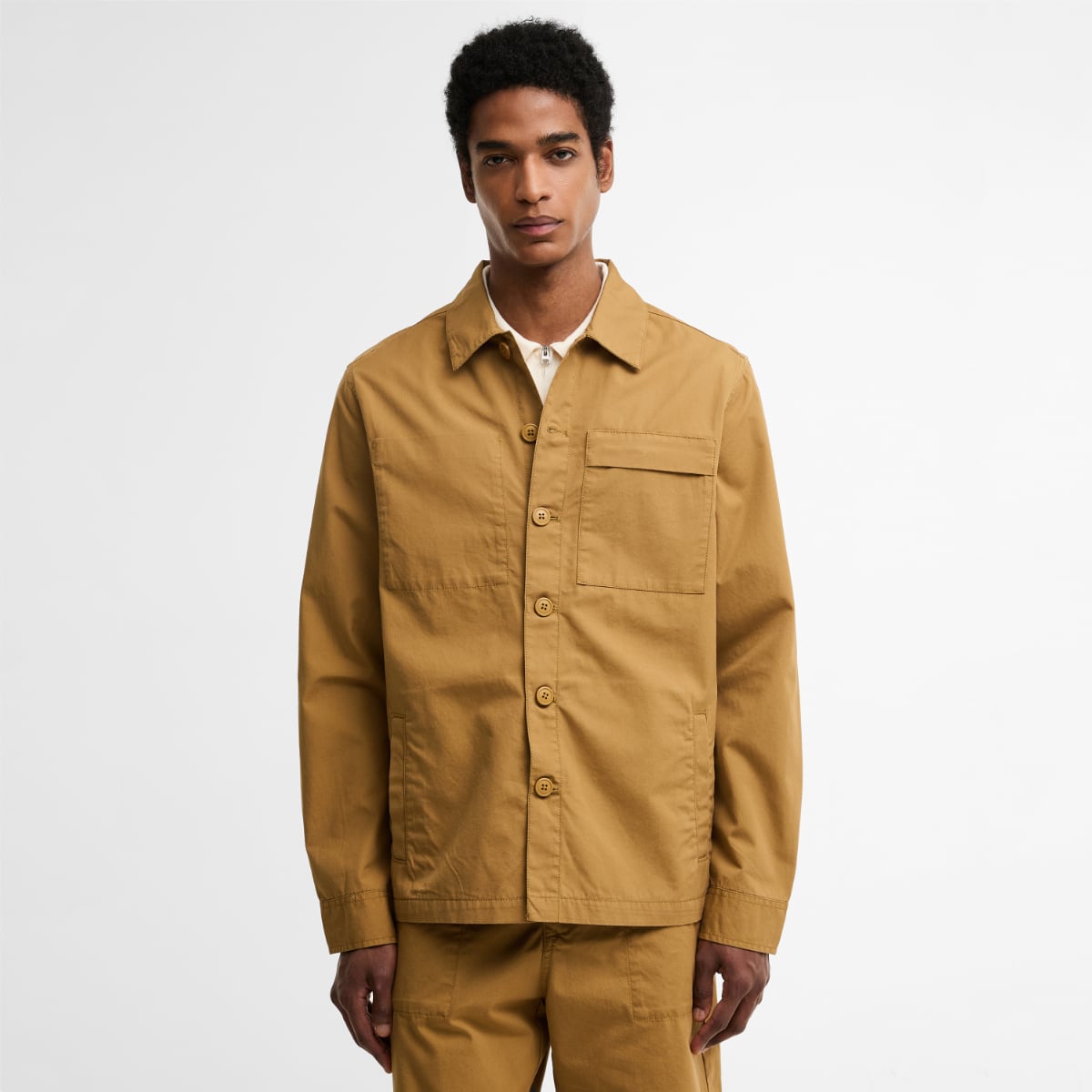 Front view of Barbour Sherburn overshirt in camel featuring a single chest pocket with flap
