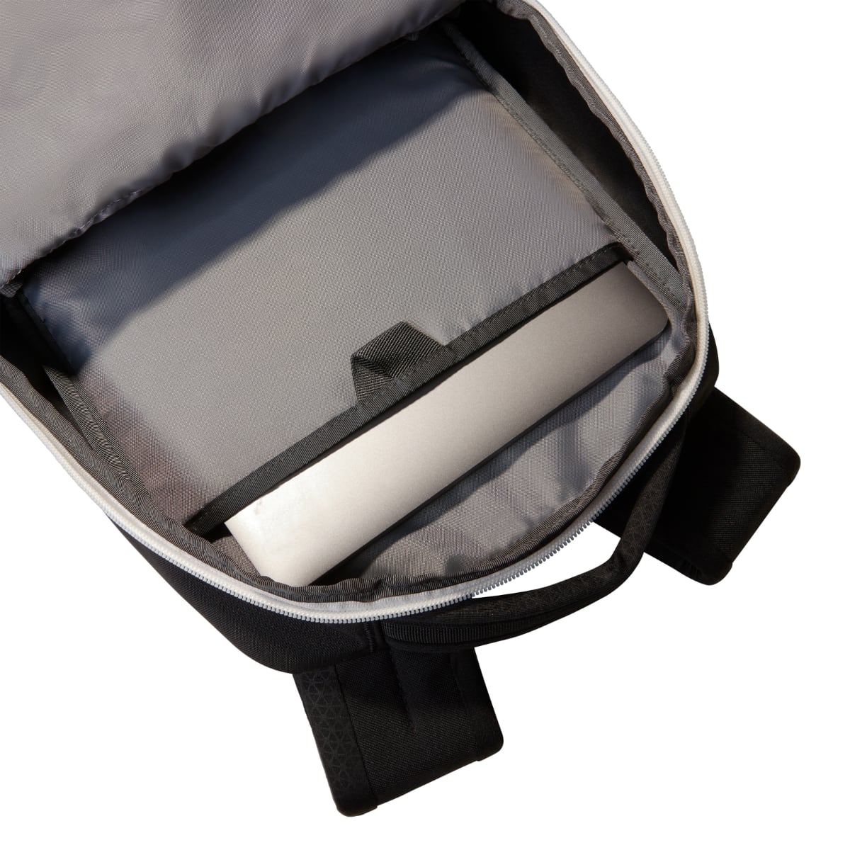 Open interior of The North Face Jester Backpack showing a padded laptop sleeve inside