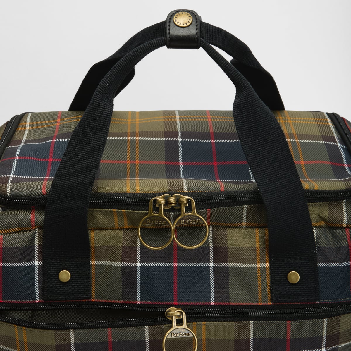 Barbour Torridon Tartan Flight Bag with plaid fabric black straps and brass zipper pulls