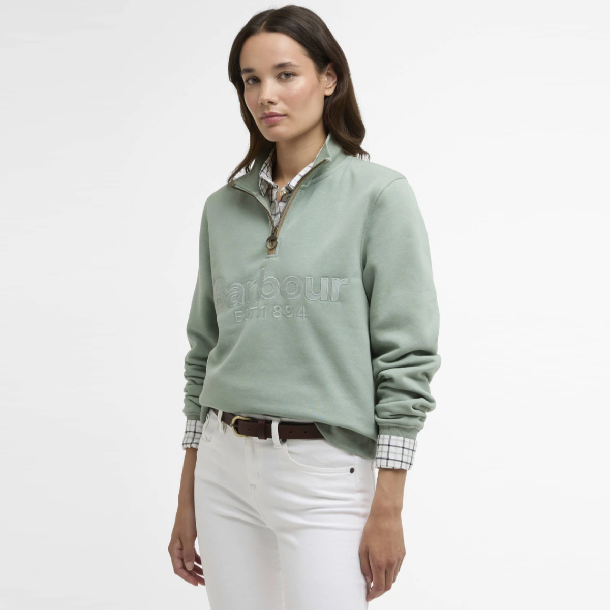 Front view of a model wearing a Blue Sage Barbour Cynthia quarter zip jumper with a plaid shirt at the collar.