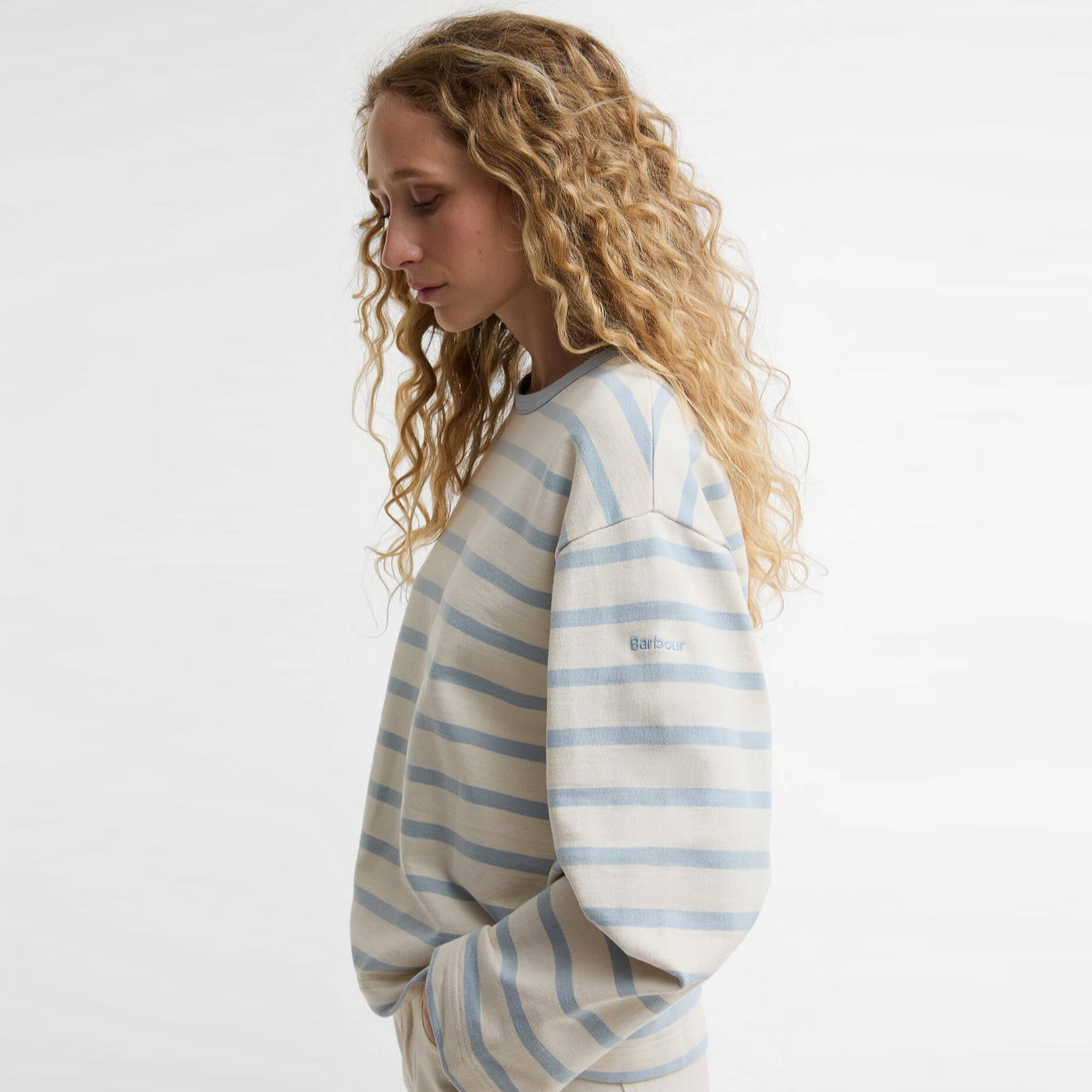 Side view of Barbour Fawley striped sweatshirt in original ecru and celestial blue with relaxed fit